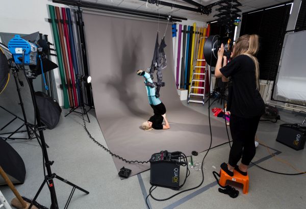 Student doing a surrealism photoshoot in photography studio