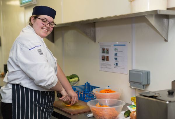 Catering student prepping their ingredients