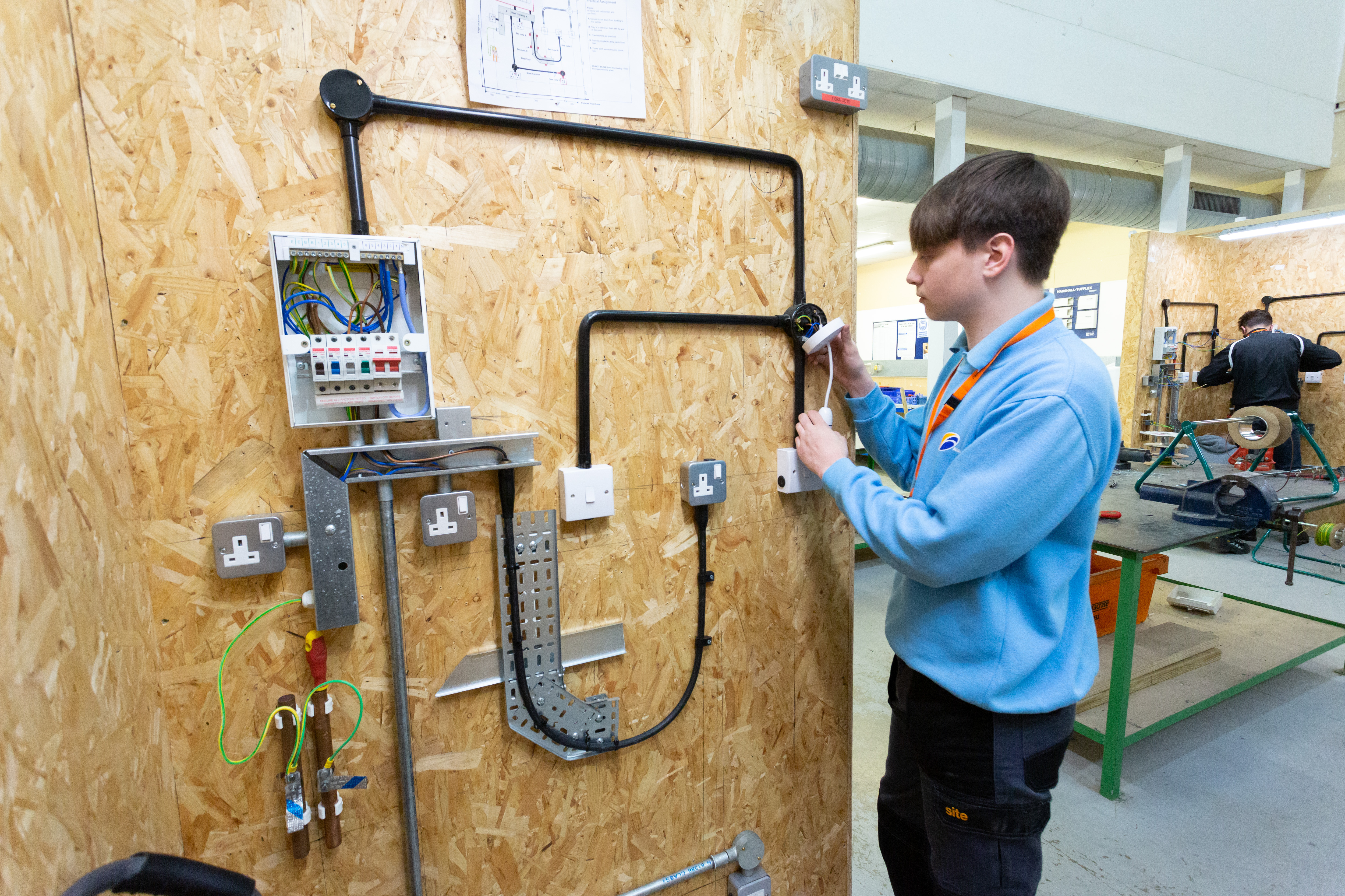 Electrical installations student working on a circuit
