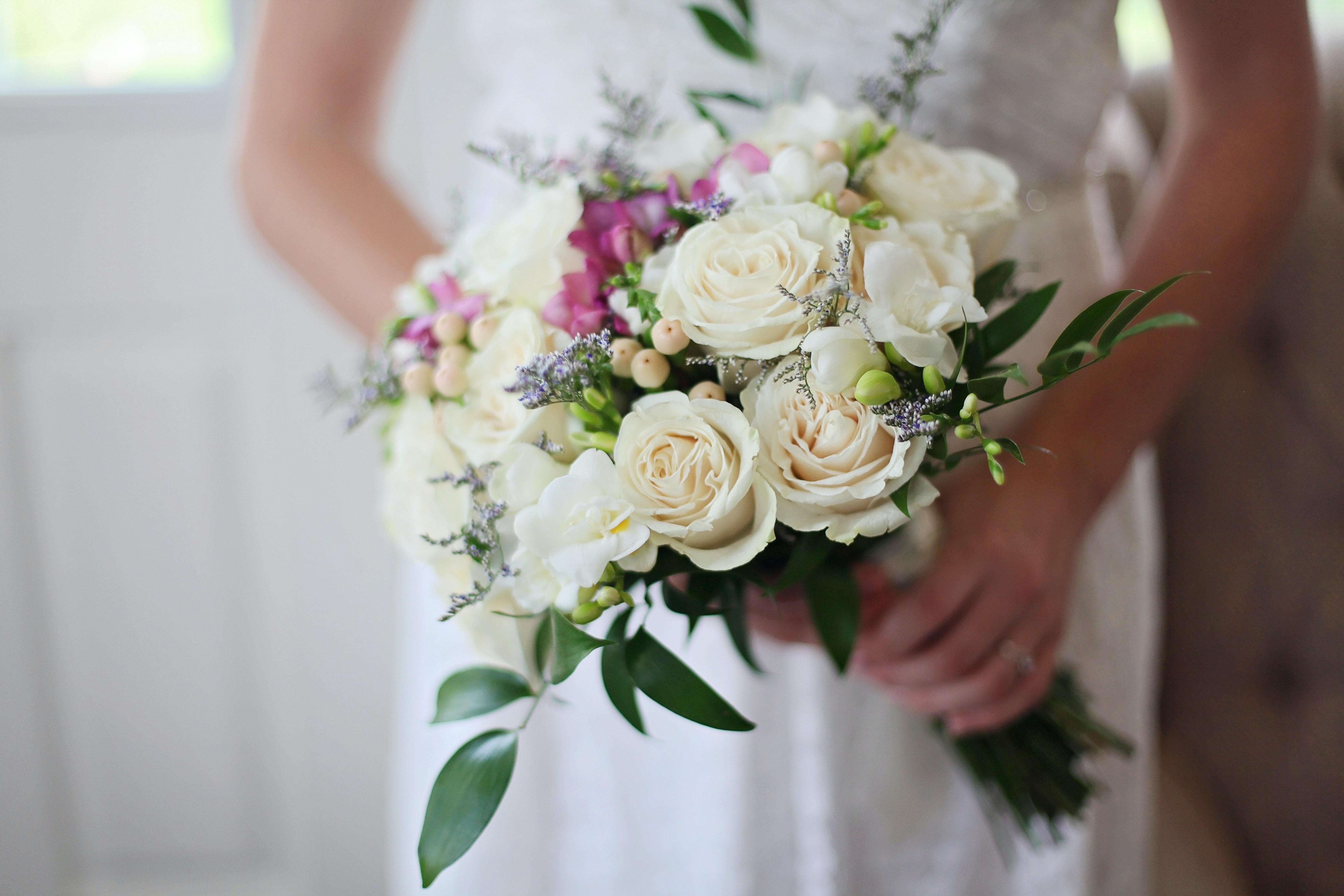 a bride holding a Bouquet of flowers